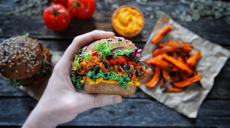 Image of person holding plant-based food