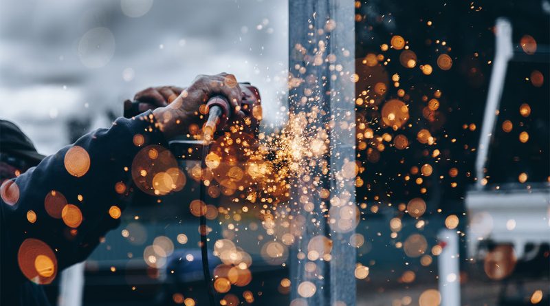 Close-up image of someone using machinery to support U.S. manufacturing article