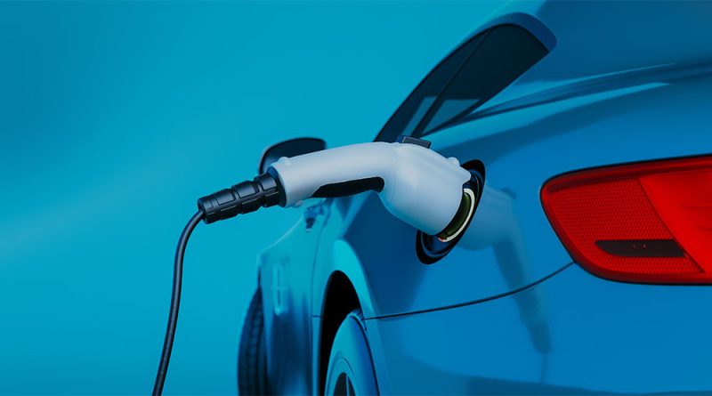 Close-up image of a silver electric car being charged to support wireless EV charging article