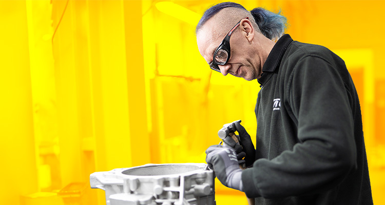 Technician working on gearbox housing
