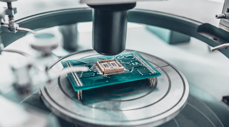An advanced semiconductor manufacturing facility with digital twin technology visualizations.