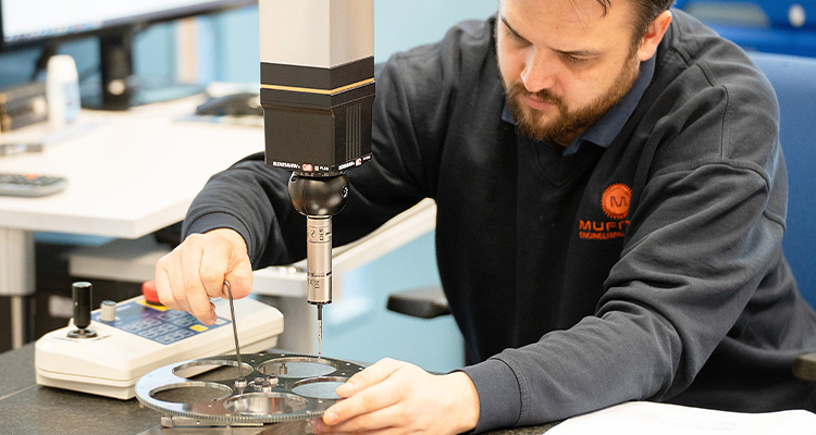 Engineer working on precision engineered component