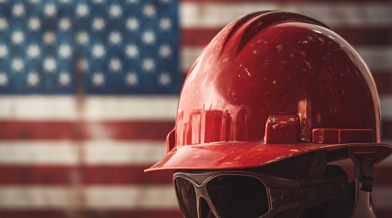 Manufacturing hard hat and goggles in front of US flag for Made in America article