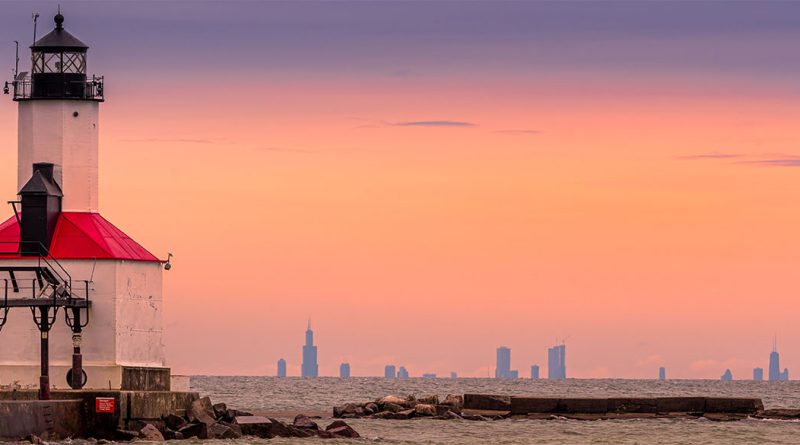 Michigan City lighthouse with Chicago in the background to support manufacturing article