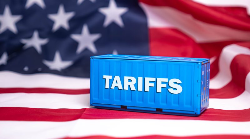 US flag with tariffs shipping container on to support supply chain disruptions article