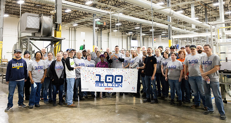 United States Playing Card Company staff celebrating 100 million decks of cards