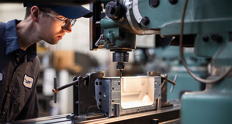 technician using vertical drill