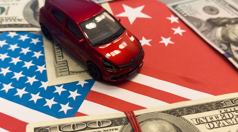 Model car on US and Chinese flags to support auto tariffs article
