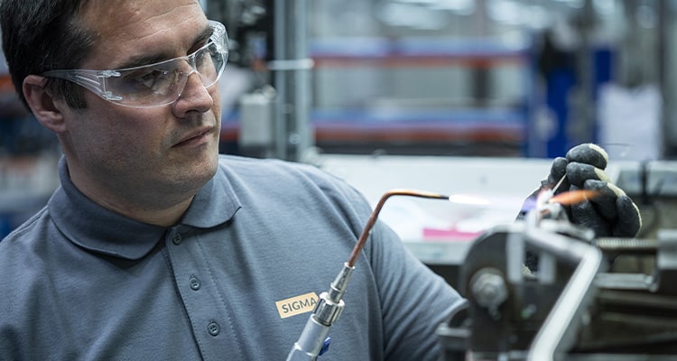 Technician soldering a component