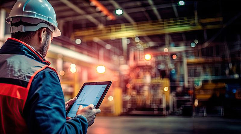 digital manufacturing illustration with man in hard hat in warehouse with tablet device