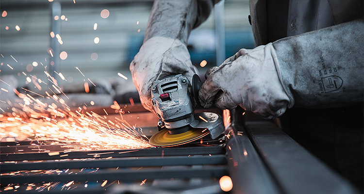 a person using an angle grinder