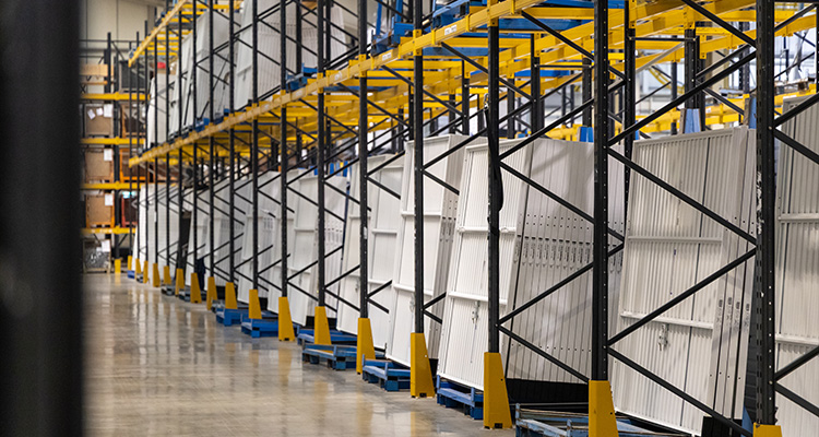 Warehouse with rows of white garage doors