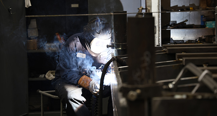 Welder welding large metal components