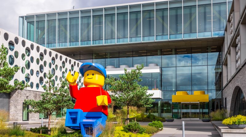 A giant Lego minifigure is set in front of the entrance of the Lego Campus, headquarters of the Lego Group
