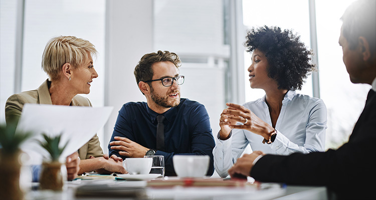 four business professionals having a meeting