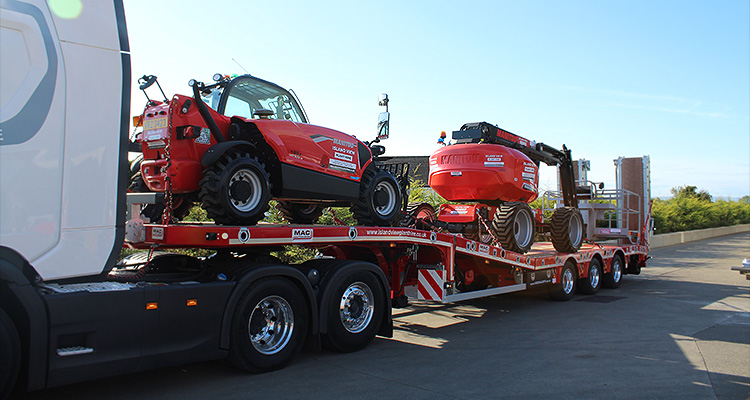 a MAC 3 Axle Stepframe Low Loader trailer transporting heavy equipment.