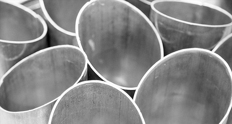 a collection of cut metal pipes or tubes