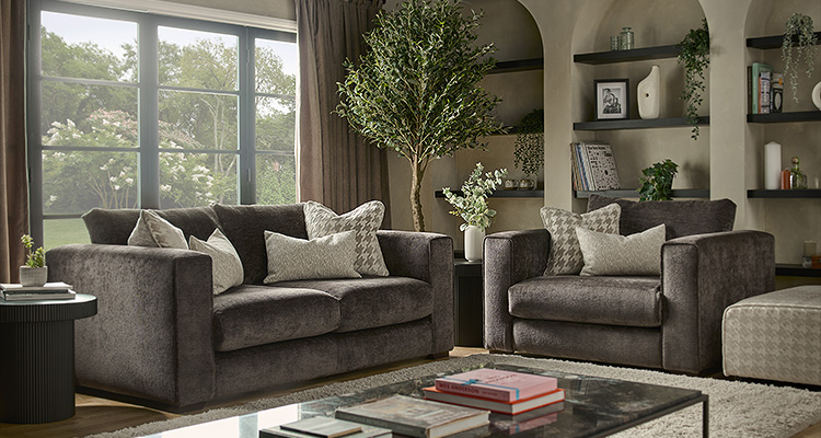 a fabric sofa and armchair set in a brown or grey color