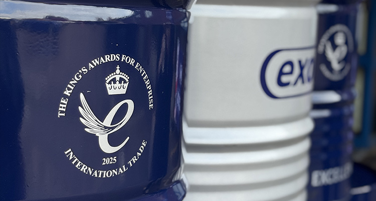 Following award success, Exol is expanding sites and continuing to deliver high quality products worldwide close-up photograph focusing on several industrial drums or barrels