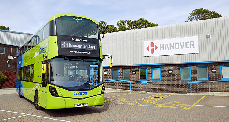 a Brighton & Hove "Coaster" bus parked outside the premises of Hanover Displays