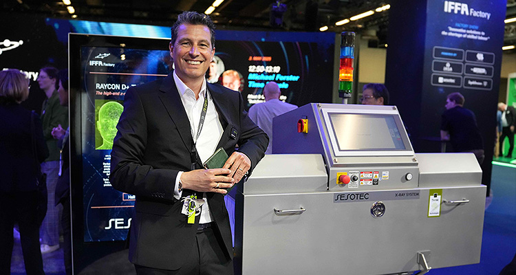 a man next to a Sesotec RAYCON D+ X-ray inspection system