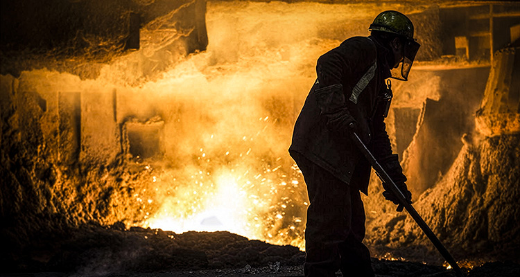 British Steel is playing a pivotal role in securing the UK’s industrial and infrastructure ambitions worker performing dangerous labor in a blast furnace